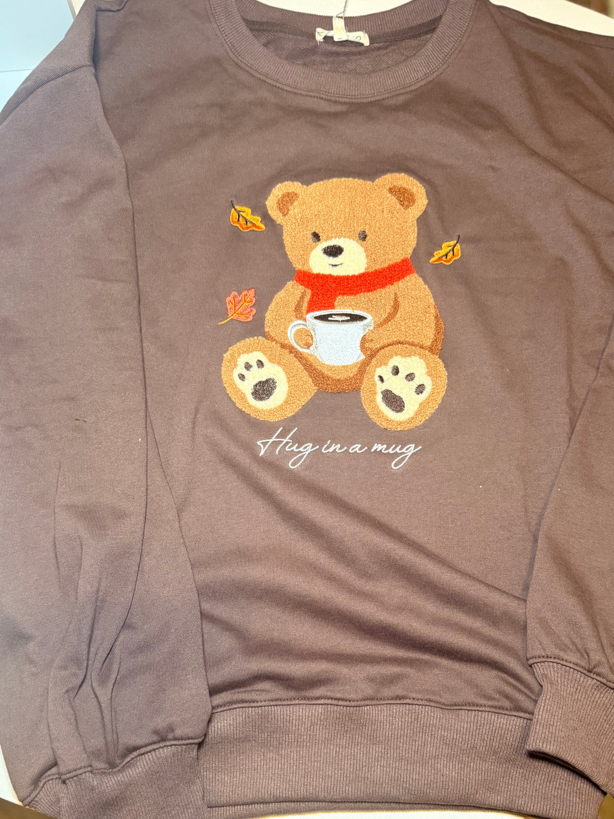 Full view of brown Hug in a Mug teddy bear crewneck sweatshirt
